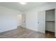 Bright bedroom featuring stylish flooring, a closet and a doorway to another room at 3609 E Palm Ln, Phoenix, AZ 85008
