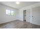 Bright bedroom with a window and a closet with paneled sliding doors, ideal for comfort and storage at 3609 E Palm Ln, Phoenix, AZ 85008