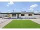Charming single-story home with fresh exterior paint, a covered carport, and manicured landscaping at 3609 E Palm Ln, Phoenix, AZ 85008