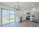 Bright kitchen with stainless steel appliances and sliding glass doors leading to backyard at 3609 E Palm Ln, Phoenix, AZ 85008