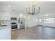 Bright kitchen flows into the living area, featuring stainless steel appliances and hardwood floors at 3609 E Palm Ln, Phoenix, AZ 85008