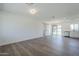 Bright and open-concept living area featuring hardwood floors and modern light fixtures at 3609 E Palm Ln, Phoenix, AZ 85008