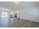 Open-concept living area featuring hardwood floors, a kitchen, and modern light fixtures at 3609 E Palm Ln, Phoenix, AZ 85008