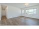 Spacious and bright living area featuring hardwood floors, fresh paint, and a lovely entrance at 3609 E Palm Ln, Phoenix, AZ 85008
