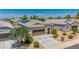 Lovely single-story home with a tile roof, solar panels and a well-maintained front yard at 36412 W Pampoloma Ave, Maricopa, AZ 85138