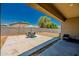 Covered patio with backyard featuring seating and a view of the desert landscape at 36412 W Pampoloma Ave, Maricopa, AZ 85138