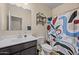 Clean bathroom featuring a shower-tub combination and a vanity with ample counter space at 36412 W Pampoloma Ave, Maricopa, AZ 85138
