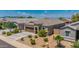 Exterior of a well-kept home featuring low-maintenance landscaping and a two car garage at 36412 W Pampoloma Ave, Maricopa, AZ 85138