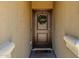 Inviting entryway featuring a solid wood door with decorative wreath and a 'Welcome' mat at 36412 W Pampoloma Ave, Maricopa, AZ 85138