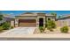 Charming single-story home with a well-manicured front yard and a two-car garage at 36412 W Pampoloma Ave, Maricopa, AZ 85138
