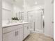 Bathroom featuring a double sink vanity and glass-enclosed shower stall at 39985 W Rio Lobo Dr, Maricopa, AZ 85138