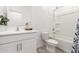 Clean bathroom featuring a shower-tub combo, white vanity, and modern fixtures and decor at 39985 W Rio Lobo Dr, Maricopa, AZ 85138