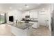 Modern kitchen with granite countertops, stainless appliances, and an open view to the living area at 39985 W Rio Lobo Dr, Maricopa, AZ 85138