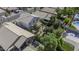 A beautiful aerial view of the backyard featuring desert landscaping including cacti and small trees at 4530 E Desert Wind Dr, Phoenix, AZ 85044