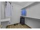 Walk-in closet features built-in shelving and wood-look floors for organized storage at 4530 E Desert Wind Dr, Phoenix, AZ 85044