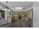 Kitchen with stainless steel appliances, wooden cabinets, and granite countertops at 4530 E Desert Wind Dr, Phoenix, AZ 85044