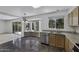 Kitchen with stainless steel appliances, granite countertops and a view of the backyard at 4530 E Desert Wind Dr, Phoenix, AZ 85044