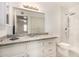 Bathroom featuring modern granite countertops, a sink, a toilet, and a standup shower at 461 W Holmes Ave # 360, Mesa, AZ 85210