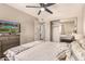Well-lit bedroom featuring a ceiling fan, TV, dresser, and closet with mirrored doors at 461 W Holmes Ave # 360, Mesa, AZ 85210