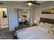 Comfortable bedroom featuring a ceiling fan, closet, and neutral decor at 461 W Holmes Ave # 360, Mesa, AZ 85210
