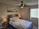 Inviting bedroom with a ceiling fan, picture window, and comfortable bedding at 461 W Holmes Ave # 360, Mesa, AZ 85210