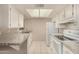 Bright kitchen with white cabinetry, modern appliances, and ample counter space at 461 W Holmes Ave # 360, Mesa, AZ 85210