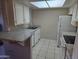 Updated kitchen with granite countertops, tile flooring, and stainless steel appliances at 461 W Holmes Ave # 360, Mesa, AZ 85210