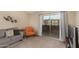 Relaxing living room showcasing balcony access, seating, and ample natural light at 461 W Holmes Ave # 360, Mesa, AZ 85210