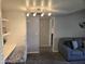 Cozy living area with a comfortable sofa, stylish chair, and built-in workspace at 461 W Holmes Ave # 360, Mesa, AZ 85210