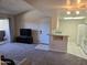Open living space with vaulted ceilings flows into the kitchen featuring granite counters and white appliances at 461 W Holmes Ave # 360, Mesa, AZ 85210