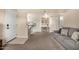 Open-concept living area features neutral decor, sofa, and access to the kitchen at 461 W Holmes Ave # 360, Mesa, AZ 85210