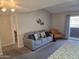 Inviting living room with a comfortable sofa and easy access to the balcony and other rooms at 461 W Holmes Ave # 360, Mesa, AZ 85210