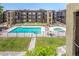 Exterior view of an outdoor pool with an adjacent hot tub at an apartment complex at 461 W Holmes Ave # 360, Mesa, AZ 85210