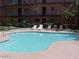 Apartment complex pool with lounge chairs for relaxation and enjoyment at 461 W Holmes Ave # 360, Mesa, AZ 85210