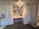 Bright workspace with built-in desk, overhead lighting, and ample storage at 461 W Holmes Ave # 360, Mesa, AZ 85210