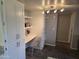 Functional workspace with a built-in desk, shelves, and overhead lighting at 461 W Holmes Ave # 360, Mesa, AZ 85210