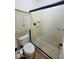 Bathroom with a neutral colored shower and glass door, toilet and storage at 4716 E Red Oak Ln # 102, Gilbert, AZ 85297