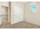 Carpeted bedroom with sliding closet doors and a large window at 4716 E Red Oak Ln # 102, Gilbert, AZ 85297