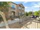 Beautiful two-story home with stone accents, a balcony, and a landscaped front yard at 4716 E Red Oak Ln # 102, Gilbert, AZ 85297