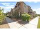 Charming townhouse with stone facade, neat landscaping, and inviting curb appeal at 4716 E Red Oak Ln # 102, Gilbert, AZ 85297