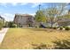 Beautiful home with a spacious front lawn, mature trees, and a welcoming facade at 4716 E Red Oak Ln # 102, Gilbert, AZ 85297
