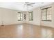 Spacious living area with tile floors, a ceiling fan, and plenty of natural light at 4716 E Red Oak Ln # 102, Gilbert, AZ 85297