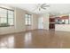 Bright open-concept living room with tile flooring, lots of natural light, and a kitchen view at 4716 E Red Oak Ln # 102, Gilbert, AZ 85297
