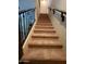 Carpeted staircase with black metal railing leading to the upper level of the home at 4716 E Red Oak Ln # 102, Gilbert, AZ 85297
