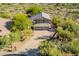 Two-story home featuring a three car garage and desert landscaping at 4801 E Quien Sabe Way, Cave Creek, AZ 85331
