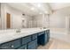 Bathroom with dual sinks, a large mirror, vanity, and a separate shower and tub at 4801 E Quien Sabe Way, Cave Creek, AZ 85331