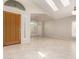 Bright foyer featuring large windows, skylights, neutral colors, and tile flooring at 4801 E Quien Sabe Way, Cave Creek, AZ 85331