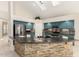 Modern kitchen boasts granite countertops, stainless steel appliances, and a central kitchen island at 4801 E Quien Sabe Way, Cave Creek, AZ 85331