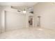 Open-concept living room with soaring ceilings and views of the staircase at 4801 E Quien Sabe Way, Cave Creek, AZ 85331