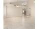 Spacious living room with high ceilings, tile flooring, and open access to staircase at 4801 E Quien Sabe Way, Cave Creek, AZ 85331